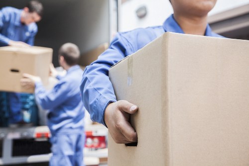Office relocation planning in Greenwich with moving team and office supplies