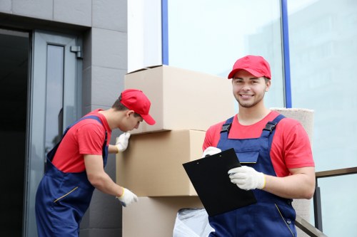 Moving van and boxes outside a Greenwich property during a removals quote