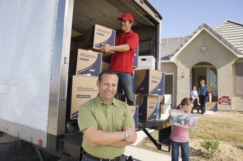 Moving team organizing and labeling belongings in Greenwich