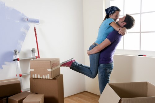 Furniture being carried through a Greenwich property entrance