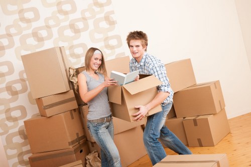 Removalists carrying furniture during a Greenwich home relocation