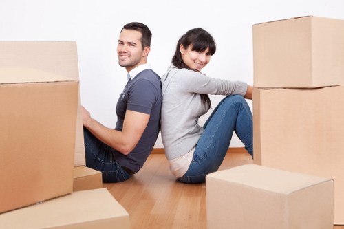 Moving boxes and furniture loaded into a Greenwich removal van