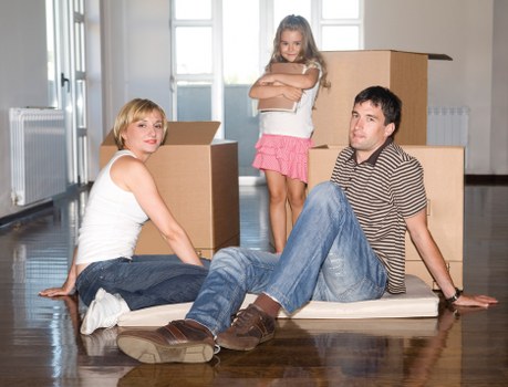 Office furniture removals in Greenwich with desks and chairs prepared for transport